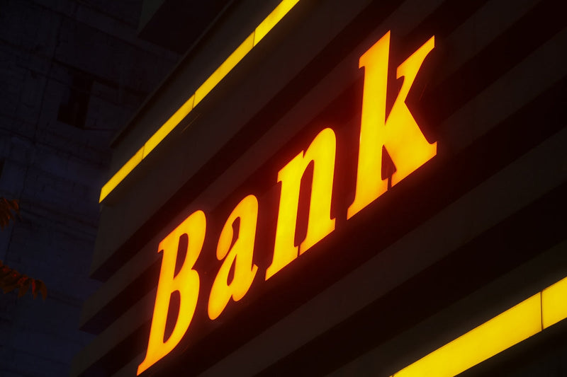 Illuminated bank sign at night