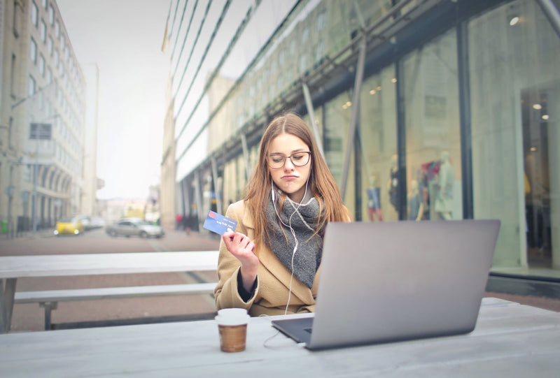 Woman holding a credit card